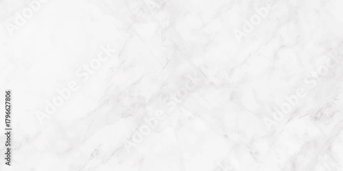 A close up view of a white marble surface displaying subtle grey veining and textural patterns