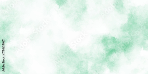 Abstract mint green watercolor texture background with soft cloudy and turquoise tones blended into cloudy, diffused splashes.	