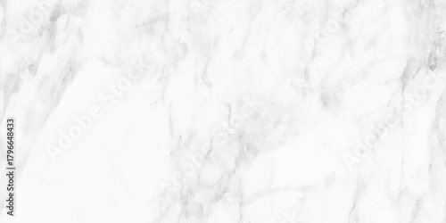 A close up view of a white marble texture with subtle grey veining patterns creates a luxurious natural background