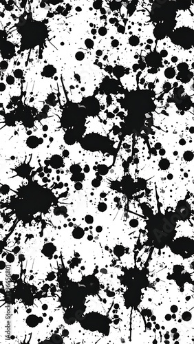 Black ink splatters and blots cover a white background, forming a chaotic, high-contrast, artistic pattern. Some are small dots, others are large spreads