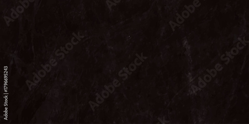 Dark distressed wrinkled black paper texture background surface close up detail macro shot wallpaper banner design element.