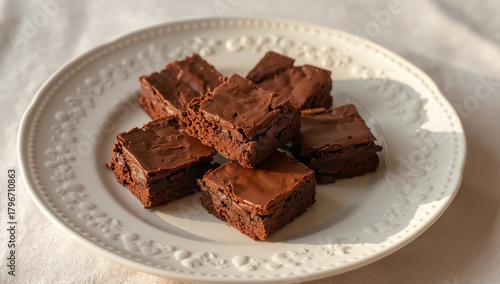 Wallpaper Mural Chocolate Squares. A Sweet Treat Presentation, Gleaming and Rich, on a White Ornamental Plate. Torontodigital.ca