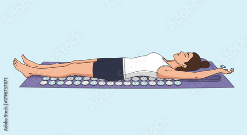 Woman lying on her back on an acupressure mat for relaxation and pain relief.