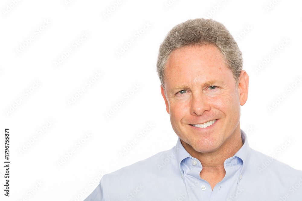 Fototapeta premium Portrait of smiling businessman isolated against white