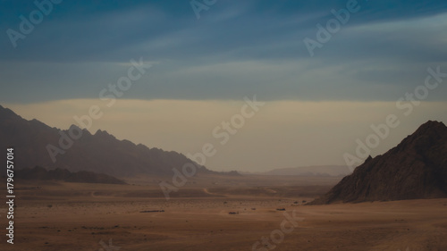 rocky mountains and desert landscape and sunset sky in Egypt