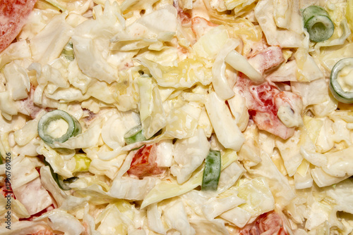 Salad of fresh cabbage with onions and tomatoes.Vegetable diet salad.Cabbage with mayonnaise.White cabbage salad.