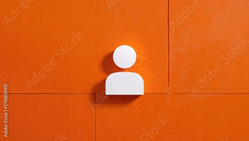 White symbol on an orange wall section, emphasizing shadow play and texture