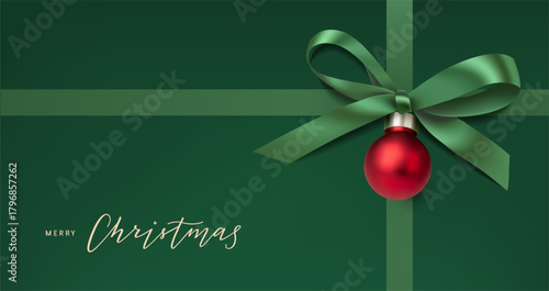 Merry Christmas calligraphic text. Green bow with Christmas red ball and ribbons on green holiday background. Vector stock illustration. Not AI