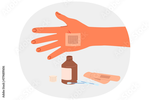 Patch on palm and medicinal ointment in glass bottle help stop bleeding and avoid blood poisoning. First aid patch for person who has been wounded due to careless handling of knife