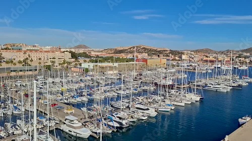 spain marcia jan 4 2024 Marina Full of Sailboats in a Coastal City Harbor Under Bright Blue Sky