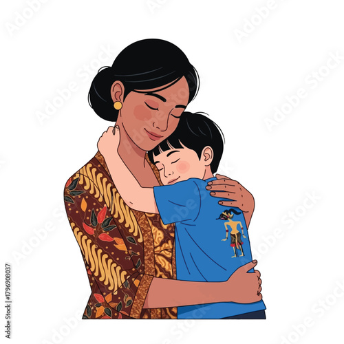A loving mother in traditional batik embraces her young son wearing a blue shirt with a cultural puppet design, showing warmth and affection.