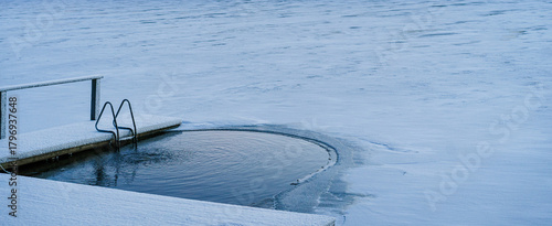 Finland. Ice swimming in a lake covered in ice