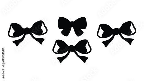Four black bows arranged on a plain white background image