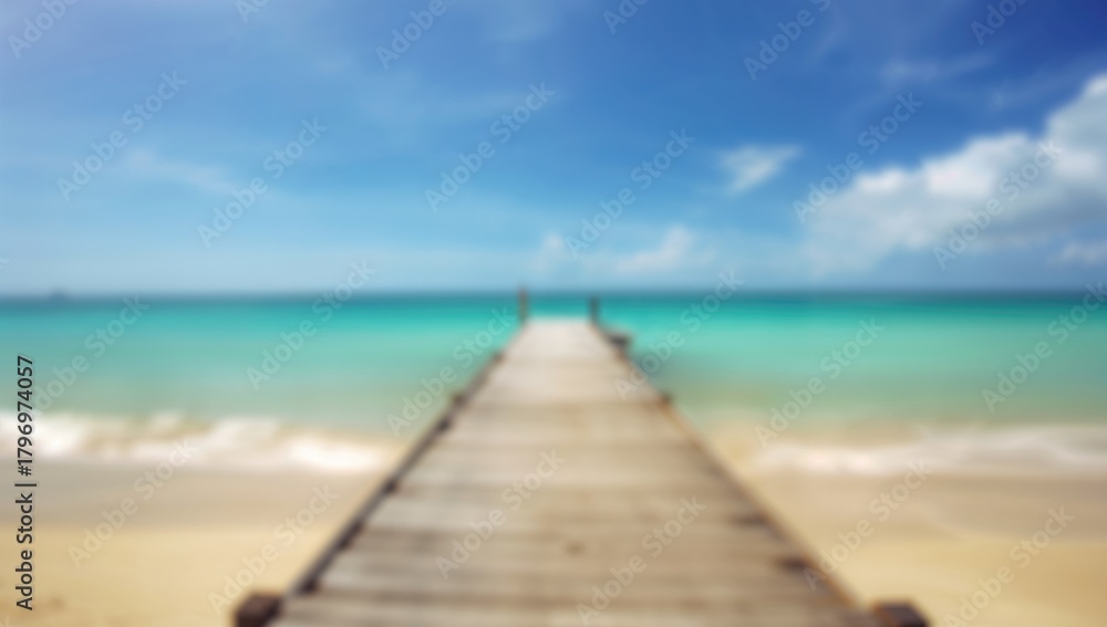 Obraz premium Blurred beach with wooden elements, serene backdrop for relaxation