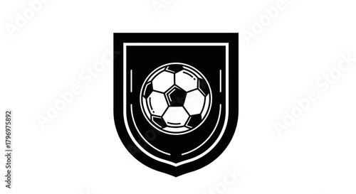 A black and white graphic of a soccer ball inside a shield-shaped crest or emblem, isolated on a white background.