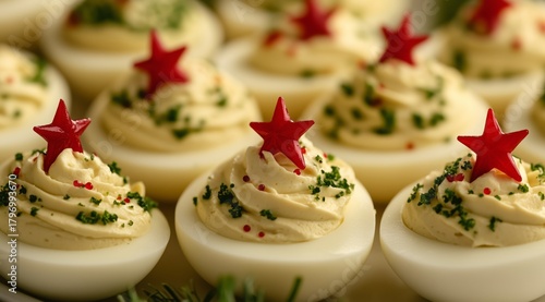 Festive Holiday Appetizer With Decorated Deviled Eggs Arranged on a Serving P...