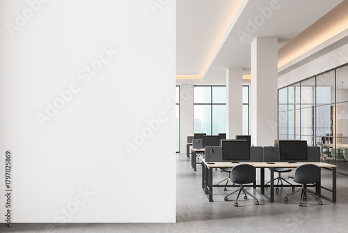 Wallpaper Mural Empty white wall mockup in modern open space office with bright interior and computer desks, perfect for poster or banner design presentation template. 3D Rendering Torontodigital.ca