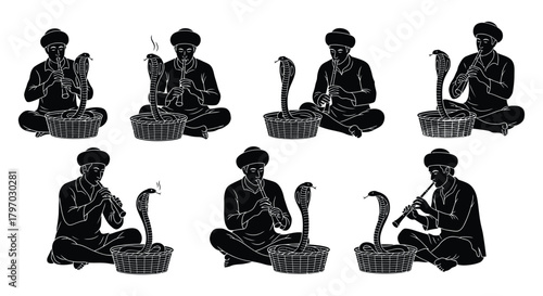 Snake charmers playing music to cobras in baskets traditional indian performance