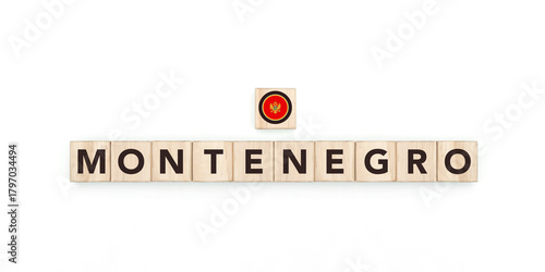 Wooden blocks bearing the name and flag of Montenegro. Montenegrin and European Culture, national identity, travel, and geography in a copy space design.