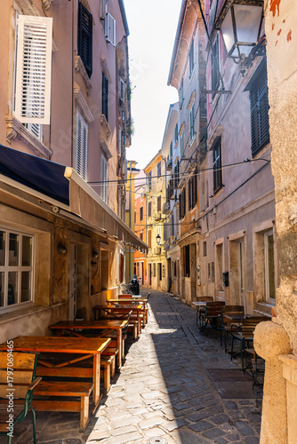 Narrow cobbled streets with colorful houses in the historic center of the coastal city of Piran, Slovenia.