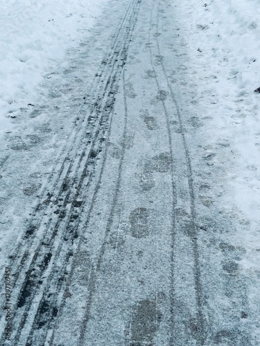 traces on snow. Winter promenade in the city. winter trail with shoe print, winter background.