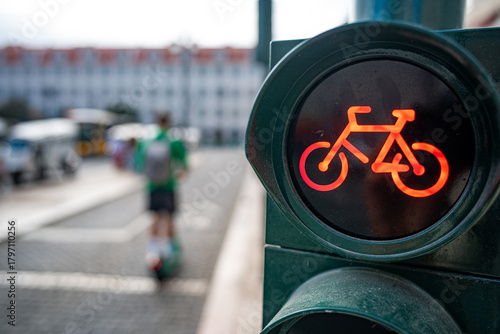 Bicycle traveling on the cycle path with traffic control via traffic lights. Lisbon, Portugal.