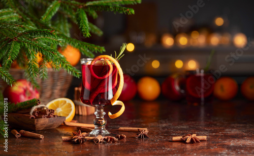 Christmas mulled wine with citrus, apples, cinnamon, anise, and rosemary.