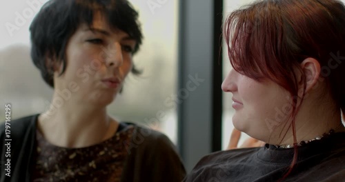 Warm cafe scene with engaged women talking, Two women exchanging deep thoughts over coffee in cozy cafe, Intimate moment captured as women converse earnestly in welcoming cafe setting