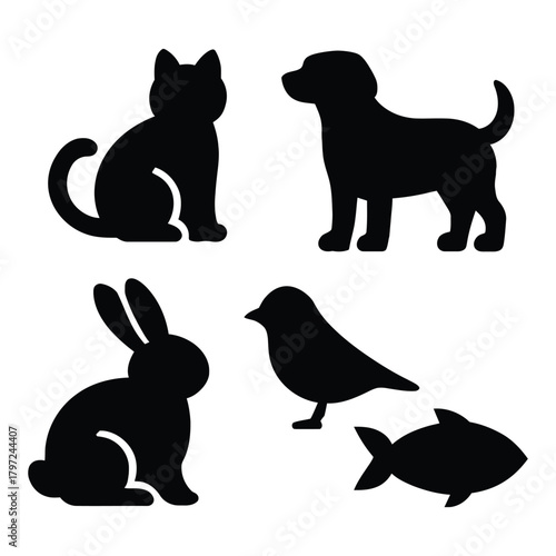 Black vector set of dog and cat, bird, and fish silhouettes