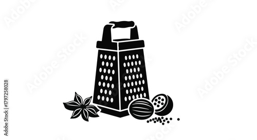 Kitchen grater with nutmeg and star anise for culinary preparation