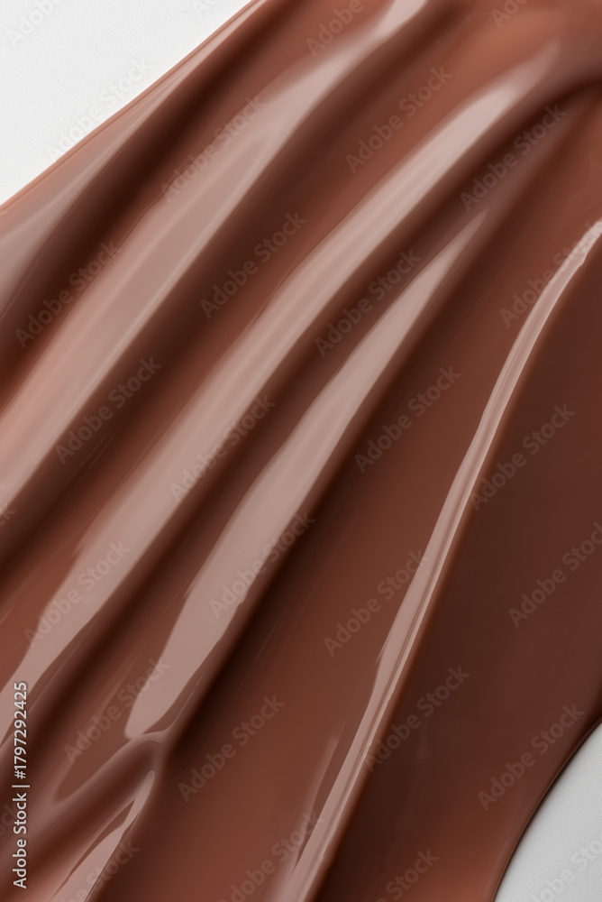 Naklejka premium Smooth melted chocolate texture with soft light reflections