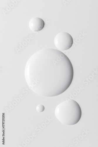 White cosmeticâ€™s product drops on white background