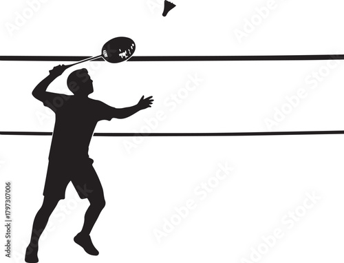 Silhouette of a badminton player actively smashing shuttlecock during match play