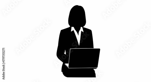 Silhouette of a professional businesswoman working on a laptop computer.