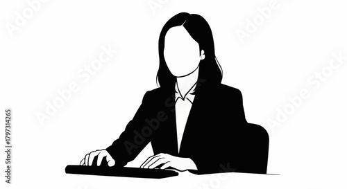 Faceless businesswoman in a suit working at a computer desk.