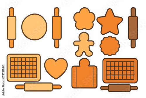 Assortment of rolling pins, raw dough, and different cookie cutter shapes for baking preparation
