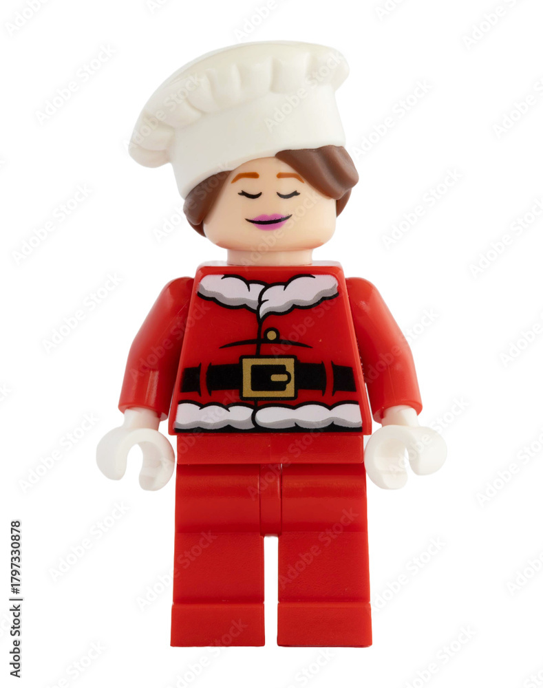 Naklejka premium Dortmund - Deutschland 13. November 2025 - Lego Figur glückliche Bäckerin im Nikolaus Kostüm - Studio Aufnahme