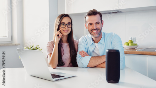 Couple using smart speaker, home assistant