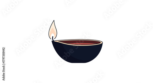 Traditional Indian Diya oil lamp with a flickering flame.