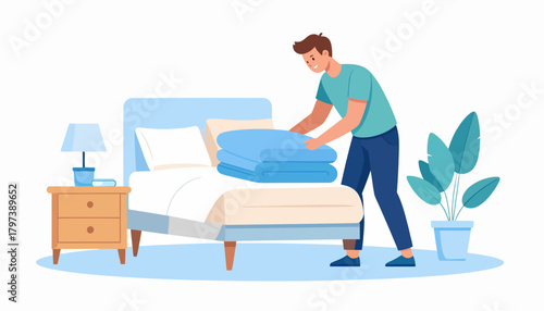 Man neatly folding blue blankets on a freshly made bed.