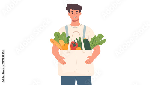 Smiling Young Man Holding a Full Grocery Bag of Fresh Vegetables and Fruits.