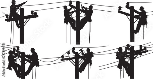Silhouettes of linemen working on utility poles lineman