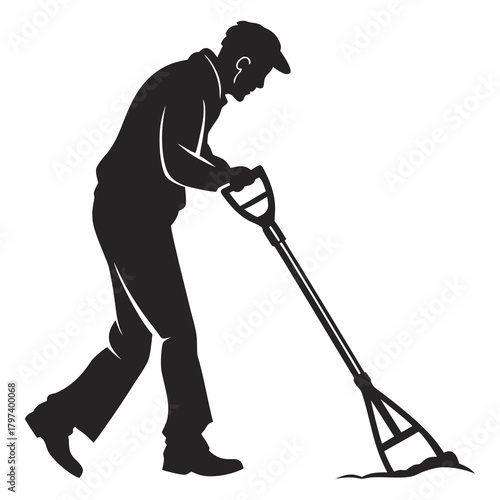 Silhouette of a man using a lawn leveler to smooth the ground, lawn care and maintenance leveling soil for a perfect lawn