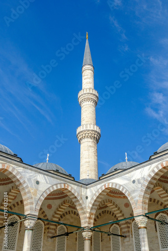 Mosque minaret under blue sky