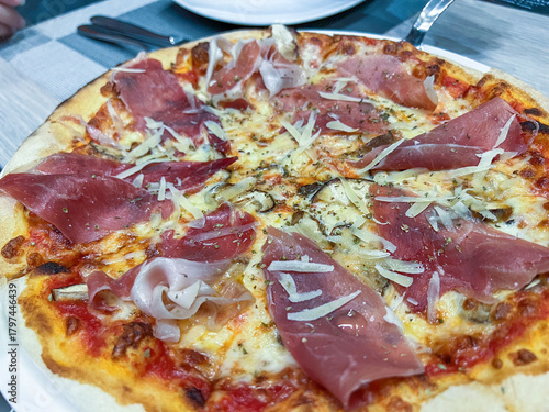 Gourmet Pizza Topped with Prosciutto and Cheese