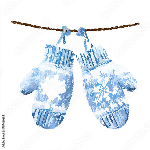 Two knitted mittens with snowflake pattern hang together
