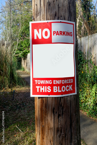 NO PARKING sign on telephone pole with copy space