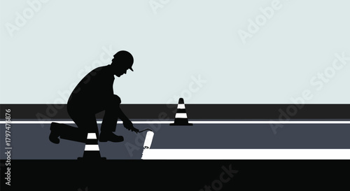 A diligent construction worker in a hard hat carefully paints a new white line on the road, ensuring safety and clear markings for traffic flow with cones nearby.