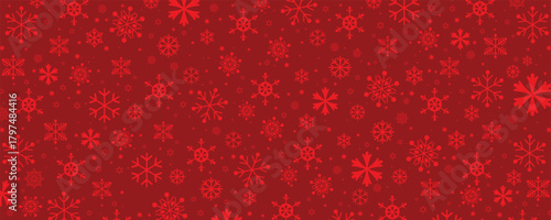 A seamless, festive pattern background composed of various sizes and styles of monochromatic red snowflakes on a deep red backdrop. This repeating texture is ideal for Christmas, winter, and holiday-t