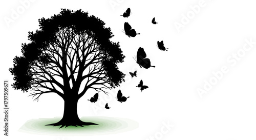 Stunning silhouette of a majestic tree with vibrant butterflies taking flight, evoking freedom and natural beauty.